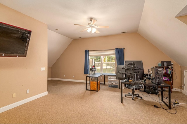 office with lofted ceiling, carpet floors, visible vents, a ceiling fan, and baseboards