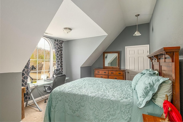 carpeted bedroom with vaulted ceiling and baseboards