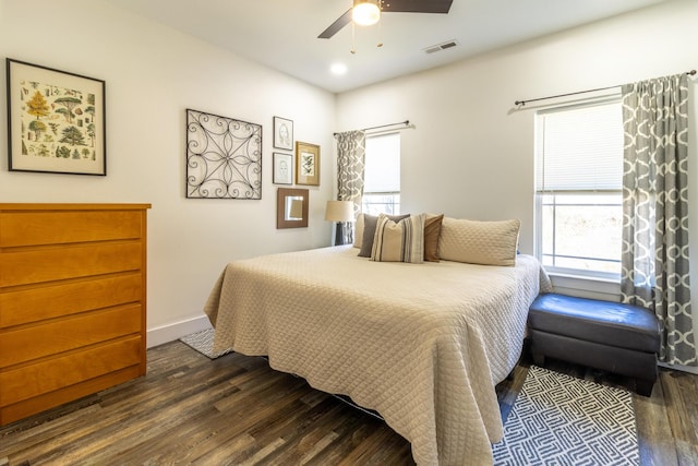 bedroom featuring visible vents, baseboards, dark wood finished floors, a ceiling fan, and recessed lighting