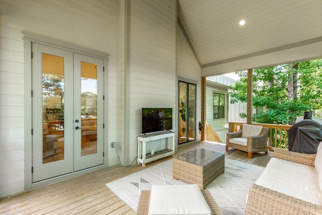 wooden terrace with french doors and area for grilling
