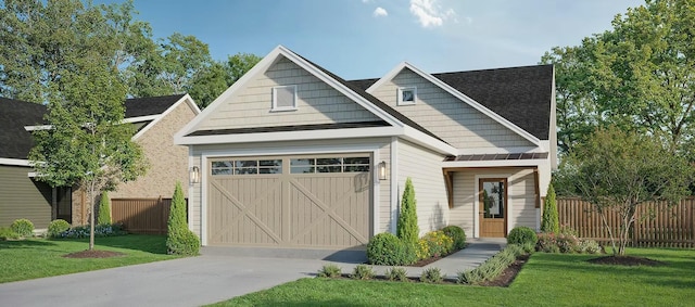 craftsman-style house featuring a garage, driveway, fence, and a front yard