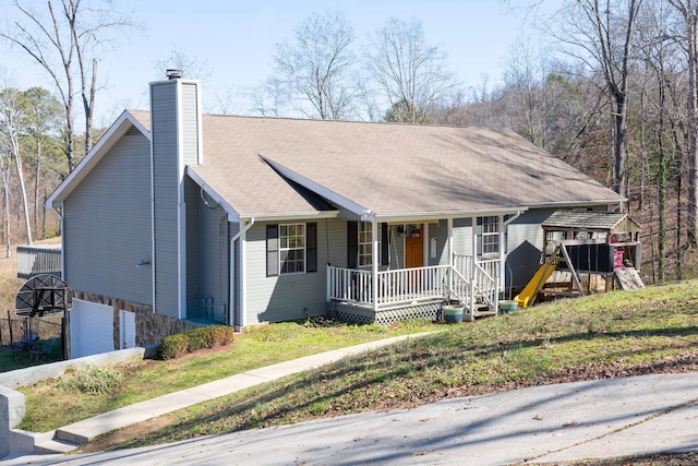 ranch-style house with a garage, a chimney, a porch, and concrete driveway