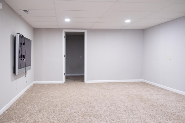 carpeted spare room with a paneled ceiling, baseboards, visible vents, and recessed lighting