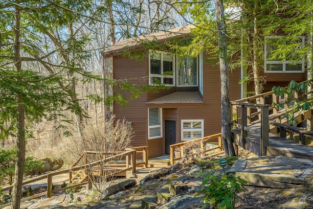 rear view of property with a deck