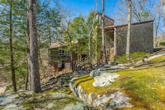 exterior space featuring stone siding