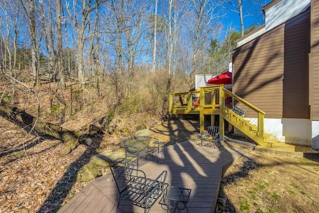 exterior space featuring outdoor dining space and stairway