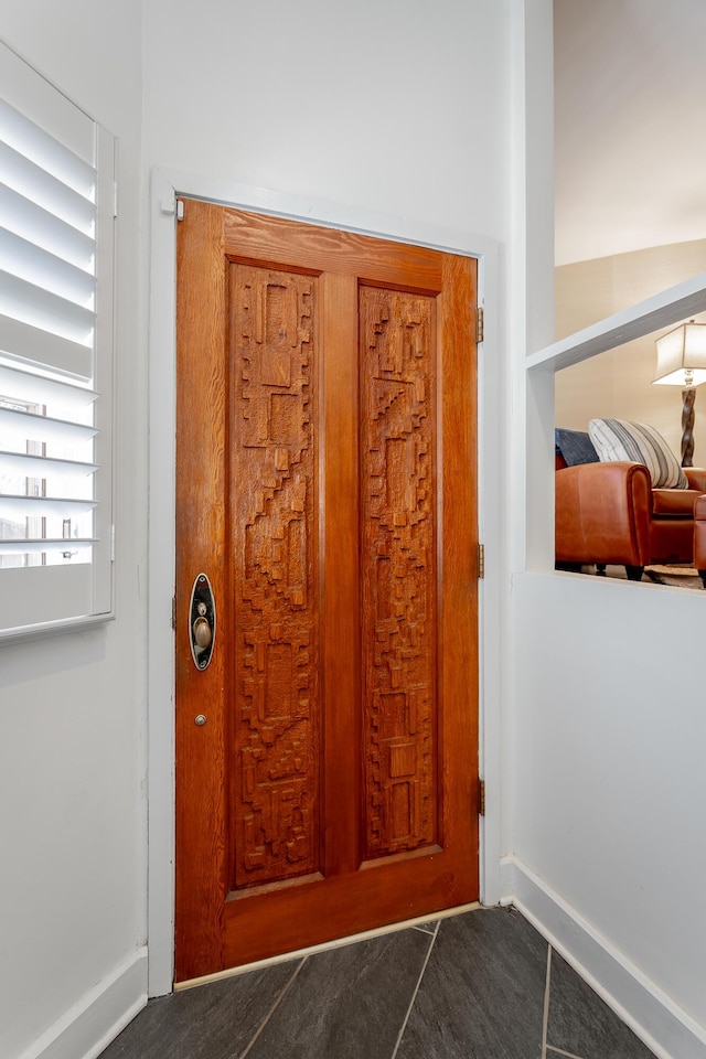 entryway featuring baseboards