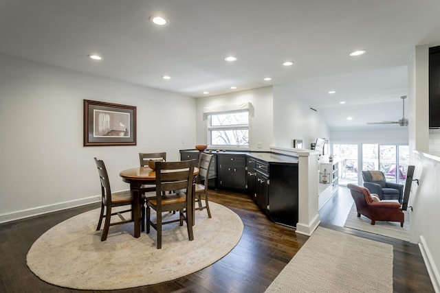 dining space featuring dark wood-style floors, recessed lighting, a healthy amount of sunlight, and baseboards