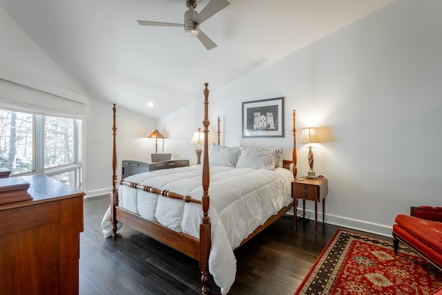 bedroom with dark wood-style floors, vaulted ceiling, and baseboards