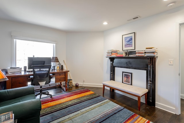 office space featuring recessed lighting, visible vents, dark wood finished floors, and baseboards