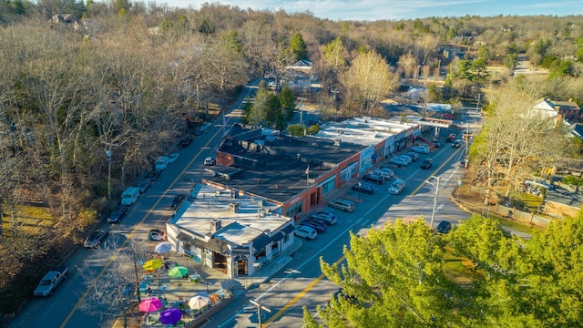 bird's eye view featuring a wooded view