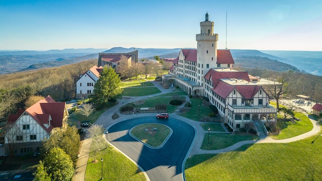 birds eye view of property with a mountain view