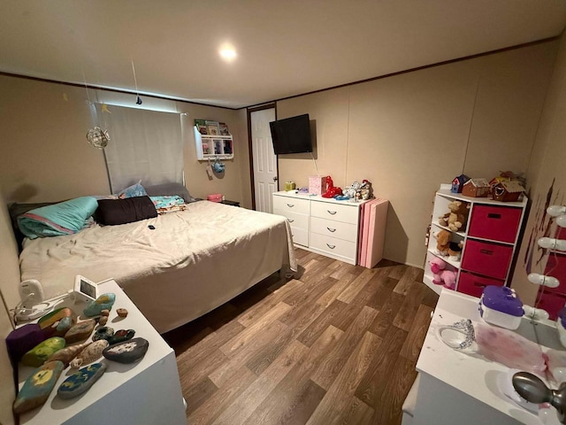 bedroom featuring wood finished floors