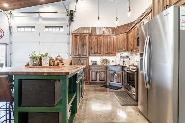 kitchen featuring open shelves, wooden counters, appliances with stainless steel finishes, a sink, and concrete flooring