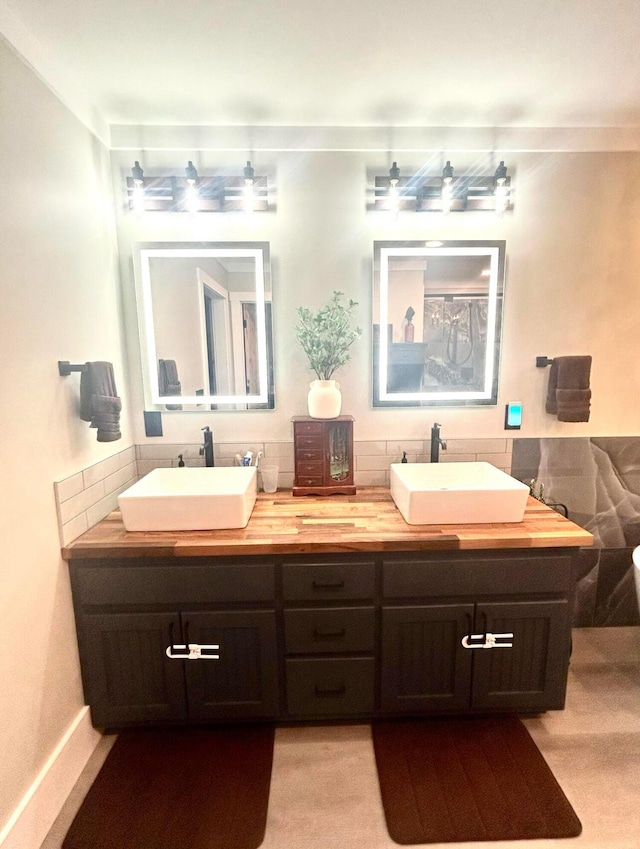 bathroom with double vanity and a sink