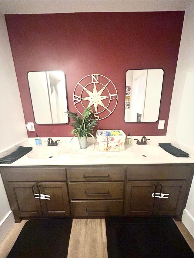 bathroom featuring double vanity and a sink