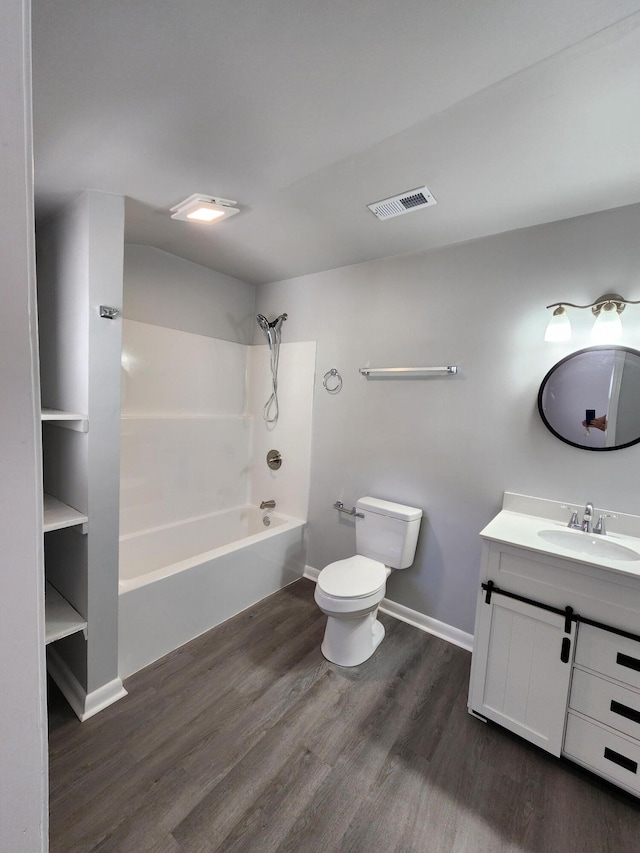 bathroom featuring shower / bath combination, visible vents, toilet, vanity, and wood finished floors