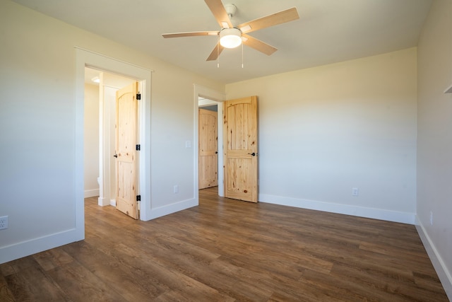 unfurnished bedroom with dark wood-style floors, baseboards, and a ceiling fan