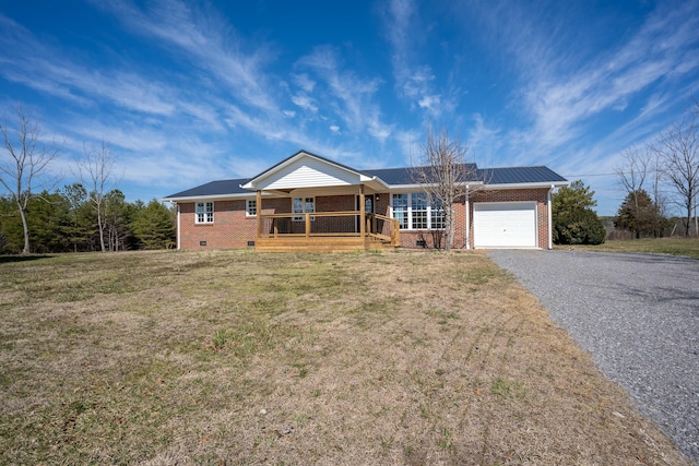 ranch-style house featuring brick siding, covered porch, an attached garage, crawl space, and driveway