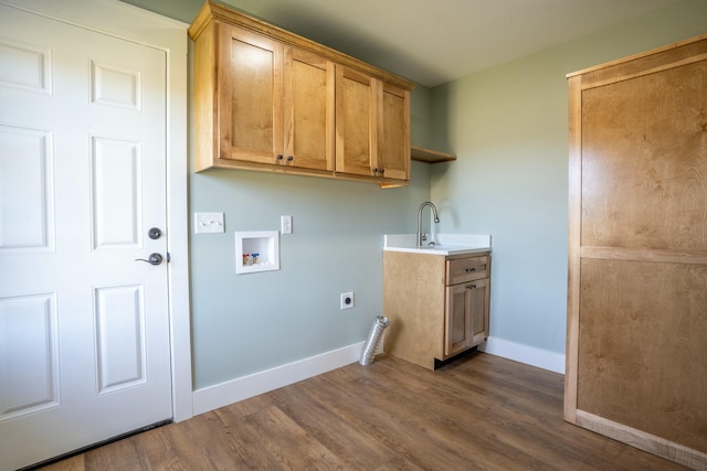 washroom featuring dark wood-style floors, washer hookup, cabinet space, electric dryer hookup, and baseboards