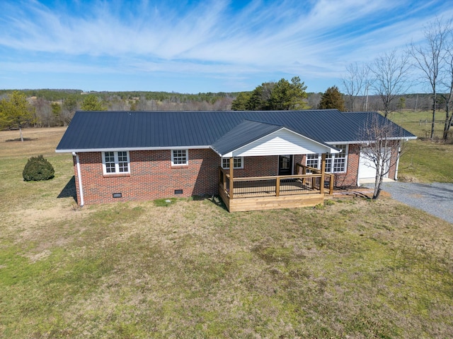 ranch-style home featuring crawl space, a garage, a front lawn, and brick siding