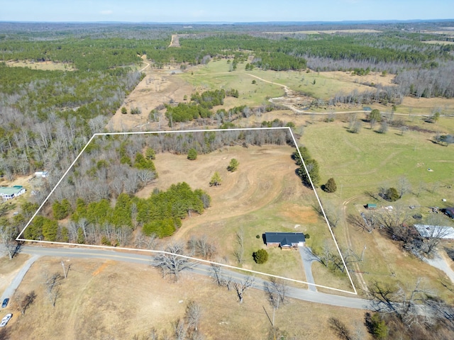 birds eye view of property with a rural view