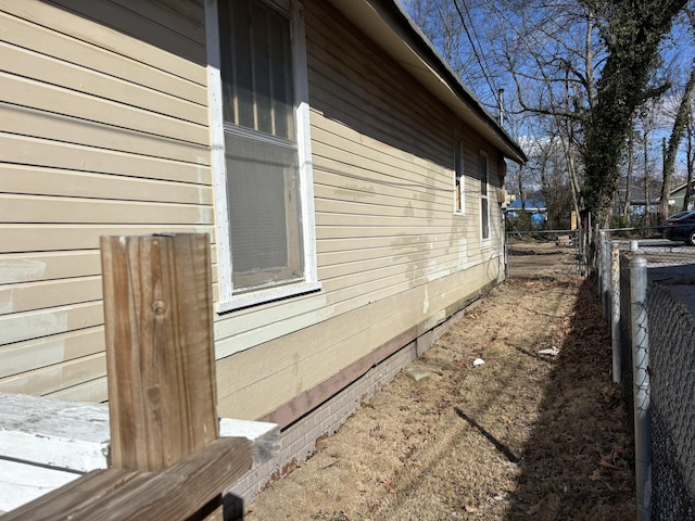 view of home's exterior with fence