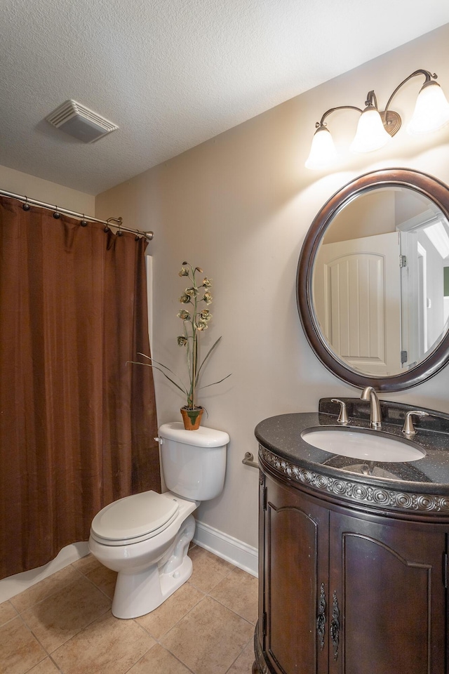 bathroom with visible vents, toilet, a textured ceiling, vanity, and tile patterned flooring
