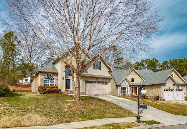 view of front of property with stone siding, a front lawn, an attached garage, a shingled roof, and driveway