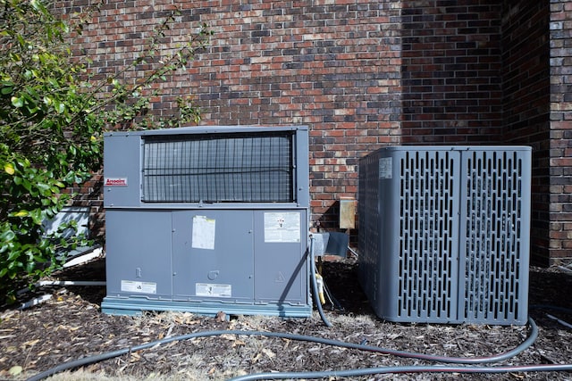 details with cooling unit and brick siding