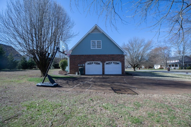 garage featuring driveway