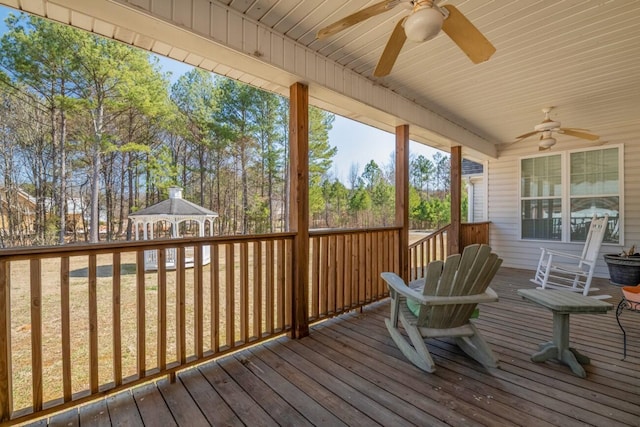 deck with a ceiling fan and a gazebo