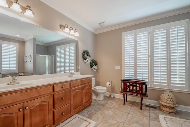 bathroom with crown molding, tile patterned flooring, a sink, and a shower stall