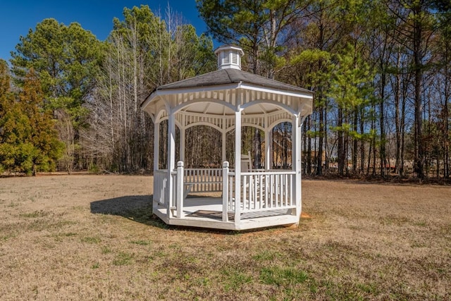 exterior space with a lawn and a gazebo