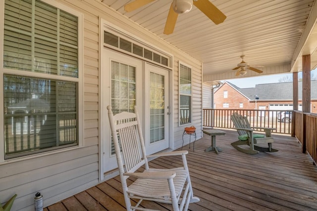 wooden deck featuring a ceiling fan