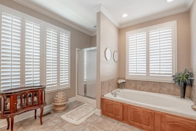 bathroom featuring tile patterned floors, crown molding, a shower stall, and a bath