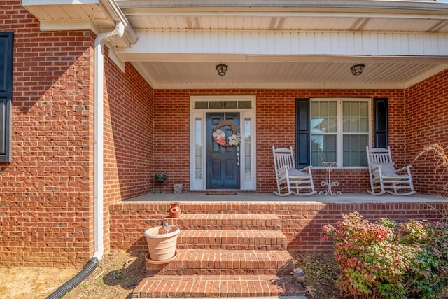 property entrance with covered porch