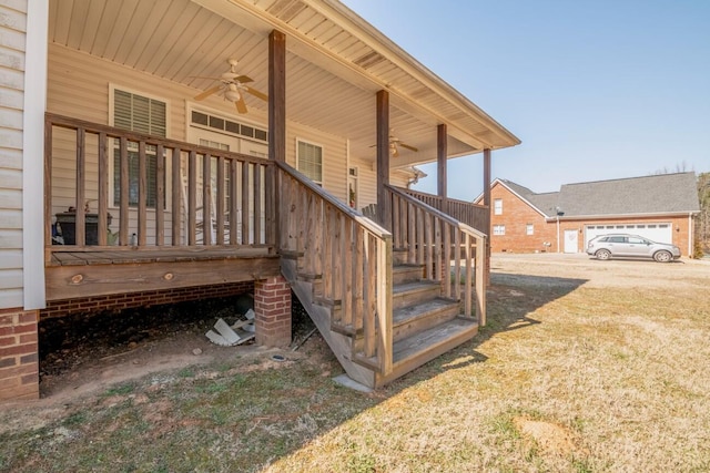 wooden deck featuring ceiling fan