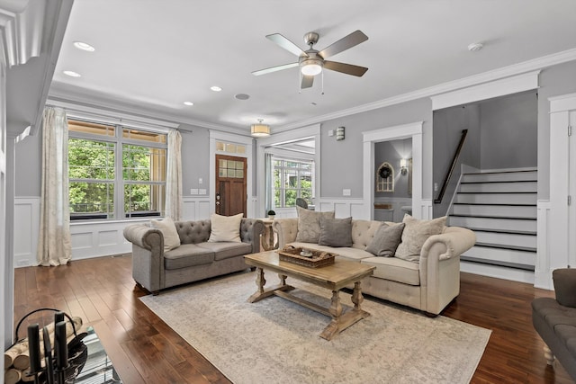 810 Boylston St, Chattanooga, TN 37405 - living room featuring a decorative wall, crown molding, stairs, ceiling fan, and dark wood-style flooring