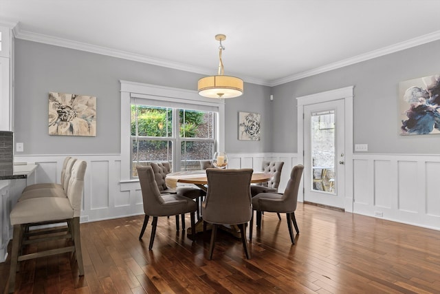810 Boylston St, Chattanooga, TN 37405 - dining space with a decorative wall, crown molding, wainscoting, and dark wood-type flooring