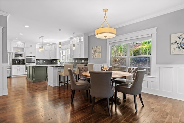 810 Boylston St, Chattanooga, TN 37405 - dining room with crown molding, dark wood-style flooring, wainscoting, a decorative wall, and recessed lighting