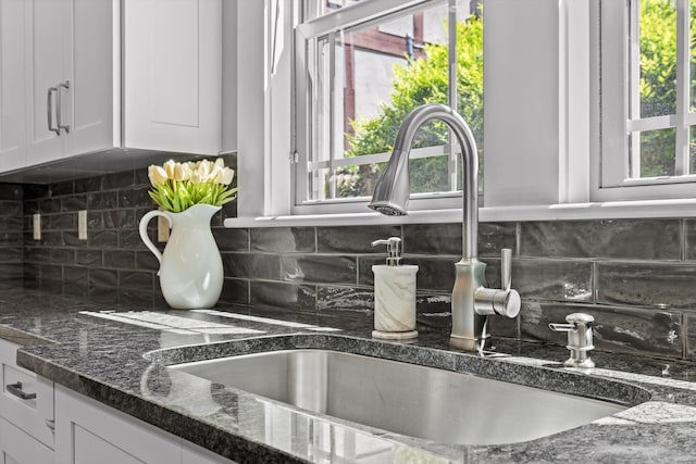 810 Boylston St, Chattanooga, TN 37405 - kitchen view of white cabinets, tasteful backsplash, and dark stone countertops