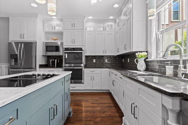 810 Boylston St, Chattanooga, TN 37405 - kitchen with appliances with stainless steel finishes, white cabinets, glass insert cabinets, recessed lighting, and backsplash