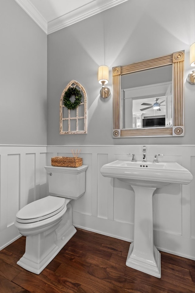 810 Boylston St, Chattanooga, TN 37405 - half bath featuring ornamental molding, a decorative wall, wood finished floors, wainscoting, and a ceiling fan