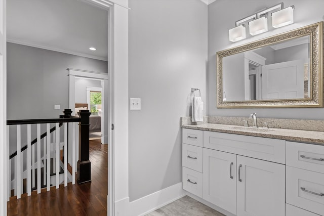 810 Boylston St, Chattanooga, TN 37405 - bathroom featuring crown molding, vanity, wood finished floors, and recessed lighting