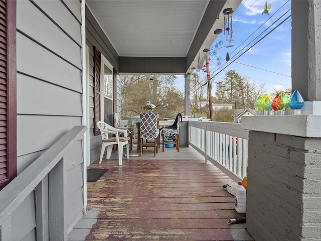 wooden deck featuring covered porch