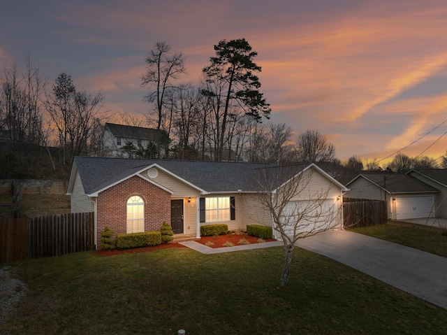 single story home with an attached garage, brick siding, fence, driveway, and a front lawn