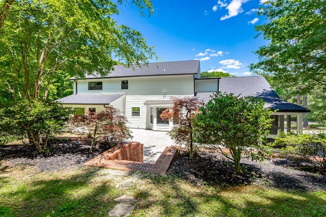 back of property with a patio area