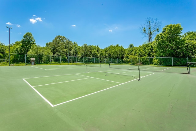 view of sport court with fence