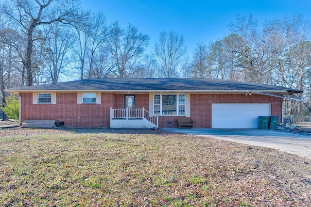 ranch-style house featuring brick siding, an attached garage, crawl space, driveway, and a front lawn